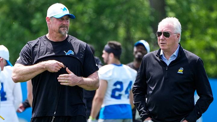 Detroit Lions head coach Dan Campbell, left, talks to president Rod Wood after practice during OTA at Meijer Performance Center in Allen Park on Friday, May 30, 2025.