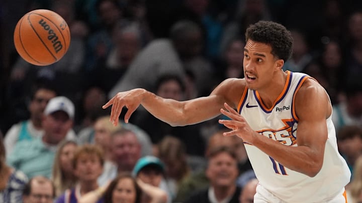 Phoenix Suns big man Oso Ighodaro passes the ball during the first quarter against the Charlotte Hornets at Spectrum Center.