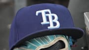 Sep 26, 2025; Toronto, Ontario, CAN; The hat and glove of Tampa Bay Rays third baseman Junior Caminero (13) in the dugout during the game against the Toronto Blue Jays at Rogers Centre. 