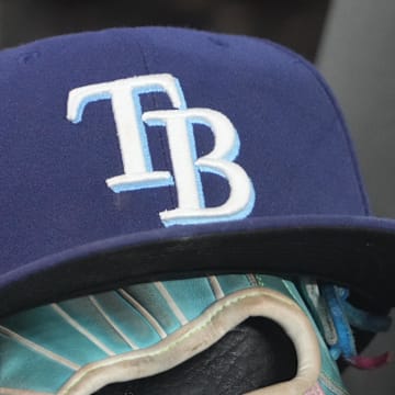 Sep 26, 2025; Toronto, Ontario, CAN; The hat and glove of Tampa Bay Rays third baseman Junior Caminero (13) in the dugout during the game against the Toronto Blue Jays at Rogers Centre. 