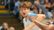 Oct 4, 2025; Charlotte, NC, USA; North Carolina Tar Heels center Henri Veesaar (13) with the ball as forward James Brown (2) defends in the first half at Dean E. Smith Center. Mandatory Credit: Bob Donnan-Imagn Images