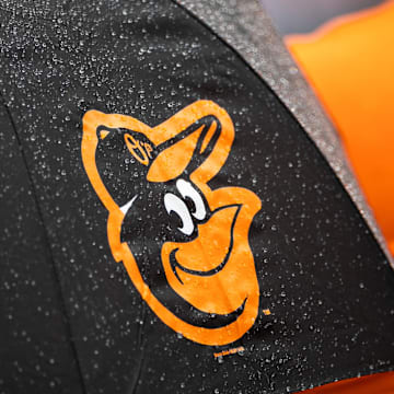 Aug 22, 2021; Baltimore, Maryland, USA; A Baltimore Orioles logo is seen on an umbrella during the game between the Baltimore Orioles and the Atlanta Braves at Oriole Park at Camden Yards. Mandatory Credit: Scott Taetsch-Imagn Images