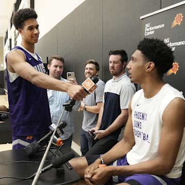 Forward Oso Ighodaro interviews forward Ryan Dunn during the Suns Summer League at Verizon 5G Performance Center on July 9, 2024, in Phoenix.