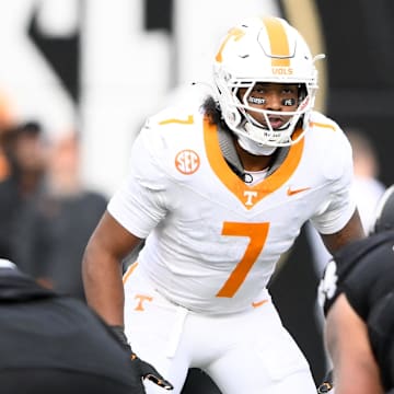 Nov 30, 2024; Nashville, Tennessee, USA;  Tennessee Volunteers linebacker Arion Carter (7) takes a peak into the backfield against the Vanderbilt Commodores during the second half at FirstBank Stadium. Mandatory Credit: Steve Roberts-Imagn Images