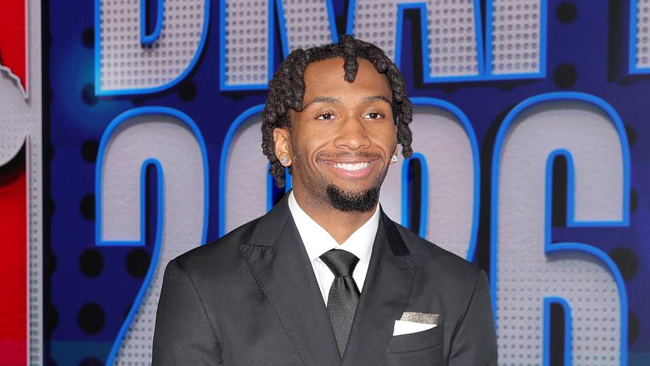 Draft prospect Darryn Peterson poses for photos on the red carpet before the 2026 NBA draft.