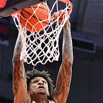 Nov 3, 2025; Syracuse, New York, USA; Syracuse Orange forward Sadiq White Jr. (0) dunks the ball against the Binghamton Bearcats in the second half at the JMA Wireless Dome. Mandatory Credit: Mark Konezny-Imagn Images
