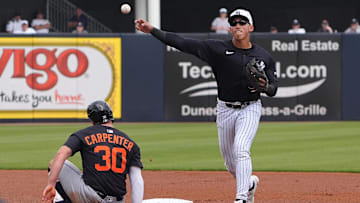 Mar 10, 2025; Tampa, Florida, USA; New York Yankees shortstop George Lombard Jr. (96) throws to first to make the double play as Detroit Tigers outfielder Kerry Carpenter (30) slides into second during the first inning at George M. Steinbrenner Field. Mandatory Credit: Dave Nelson-Imagn Images