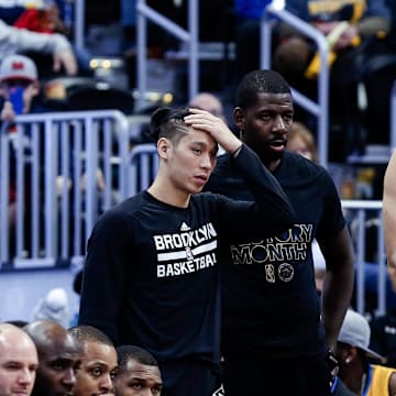 Feb 24, 2017; Denver, CO, USA; Brooklyn Nets guard Jeremy Lin (7) and Brooklyn Nets forward Andrew Nicholson (44) and center Brook Lopez (11) look on from the bench in the fourth quarter against the Denver Nuggets at the Pepsi Center. The Nuggets won 129-109. Mandatory Credit: Isaiah J. Downing-Imagn Images