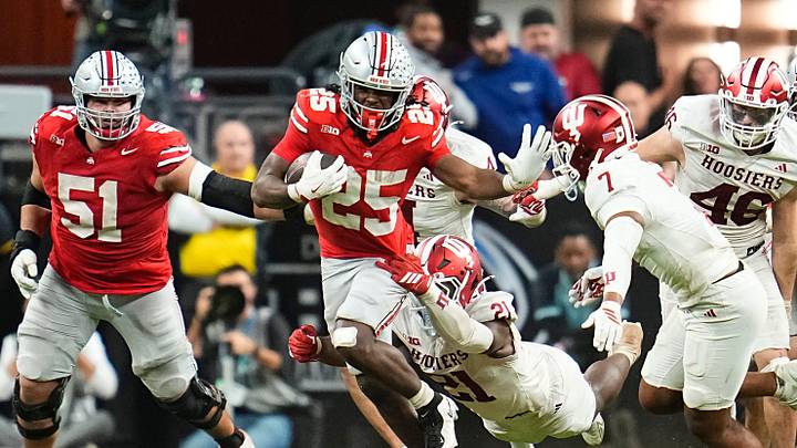 Ohio State Buckeyes running back Bo Jackson (25) runs through Indiana Hoosiers linebacker Rolijah Hardy (21) during the Big Ten Conference championship game at Lucas Oil Stadium in Indianapolis on Dec. 6, 2025. Ohio State lost 13-10.