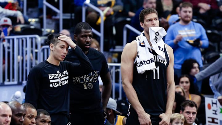 Feb 24, 2017; Denver, CO, USA; Brooklyn Nets guard Jeremy Lin (7) and Brooklyn Nets forward Andrew Nicholson (44) and center Brook Lopez (11) look on from the bench in the fourth quarter against the Denver Nuggets at the Pepsi Center. The Nuggets won 129-109. Mandatory Credit: Isaiah J. Downing-Imagn Images