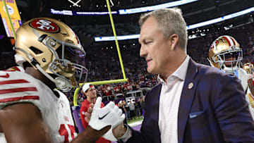 San Francisco 49ers wide receiver Jauan Jennings (L) and general manager John Lynch (R)