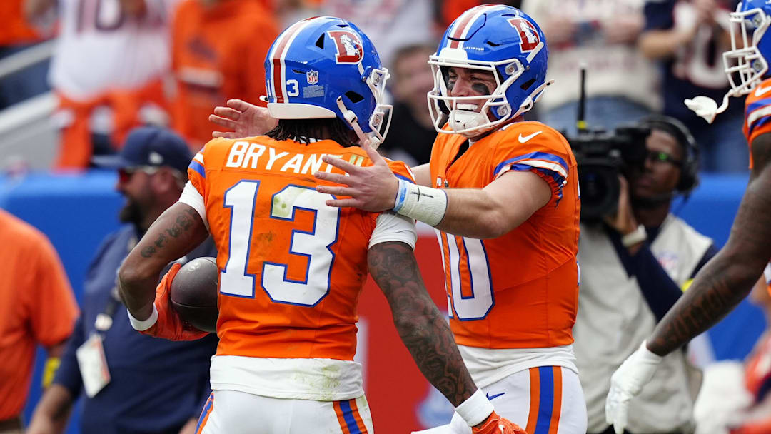 Oct 26, 2025; Denver, Colorado, USA; Denver Broncos wide receiver Pat Bryant (13) celebrates with quarterback Bo Nix (10) after scoring a touchdown against the Dallas Cowboys in the first half at Empower Field at Mile High. Mandatory Credit: Ron Chenoy-Imagn Images