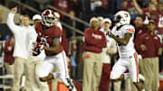 Nov 29, 2014; Tuscaloosa, AL, USA; Alabama Crimson Tide wide receiver Amari Cooper (9) catches a touchdown pass in the third quarter  past Auburn Tigers defensive back Jonathon Mincy (6) at Bryant-Denny Stadium. Mandatory Credit: John David Mercer-Imagn Images
