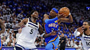May 28, 2025; Oklahoma City, Oklahoma, USA; Oklahoma City Thunder guard Shai Gilgeous-Alexander (2) drives to the basket against Minnesota Timberwolves guard Anthony Edwards (5) and guard Mike Conley (10) during the fourth quarter in game five of the western conference finals for the 2025 NBA Playoffs at Paycom Center. Mandatory Credit: Alonzo Adams-Imagn Images
