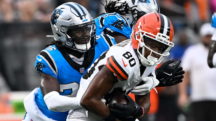 Aug 8, 2025; Charlotte, North Carolina, USA;  Cleveland Browns wide receiver Jamari Thrash (80) with the ball as Carolina Panthers cornerback Chau Smith-Wade (26) defends in the first quarter at Bank of America Stadium. Mandatory Credit: Bob Donnan-Imagn Images