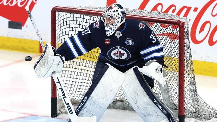 Mar 26, 2026; Winnipeg, Manitoba, CAN; Winnipeg Jets goaltender Connor Hellebuyck (37) warms up before a game against the Colorado Avalanche at Canada Life Centre. Mandatory Credit: James Carey Lauder-Imagn Images