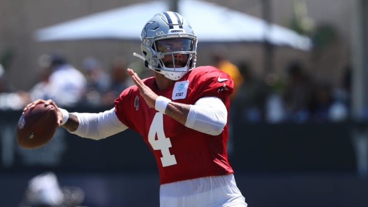 Jul 31, 2024; Oxnard, CA, USA; Dallas Cowboys quarterback Dak Prescott (4) throws next to quarterback Cooper Rush (10) during training camp at the River Ridge Playing Fields in Oxnard, California.  