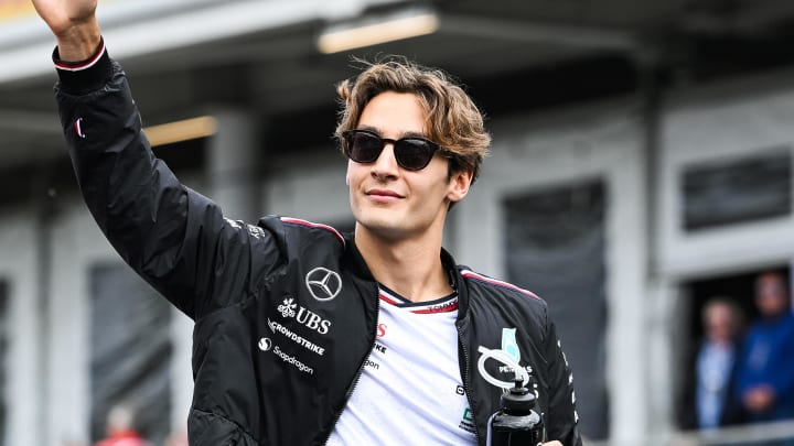 Jun 9, 2024; Montreal, Quebec, CAN; Mercedes driver George Russell (GBR) salutes the crowd during the drivers parade of the Canadien Grand Prix at Circuit Gilles Villeneuve. Mandatory Credit: David Kirouac-USA TODAY Sports