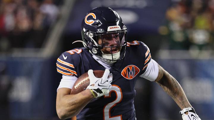 Dec 20, 2025; Chicago, Illinois, USA; Chicago Bears wide receiver DJ Moore (2) runs after the catch against Green Bay Packers guard Lecitus Smith (68) during the first quarter at Soldier Field. Mandatory Credit: Mike Dinovo-Imagn Images