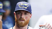 Tampa Bay Rays starting pitcher Drew Rasmussen (57) high fives teammates after being substituted against the Los Angeles Dodgers during the sixth inning at George M. Steinbrenner Field. 