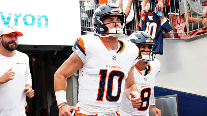 Aug 18, 2024; Denver, Colorado, USA; Denver Broncos quarterback Bo Nix (10) and quarterback Jarrett Stidham (8) before the preseason game against the Green Bay Packers at Empower Field at Mile High. 