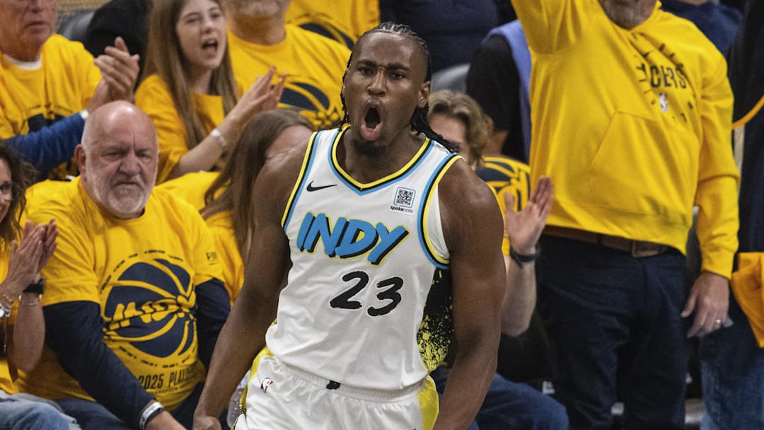 Apr 19, 2025; Indianapolis, Indiana, USA;  Indiana Pacers forward Aaron Nesmith (23) celebrates a made basket  in the first half against the Milwaukee Bucks at Gainbridge Fieldhouse. Mandatory Credit: Trevor Ruszkowski-Imagn Images