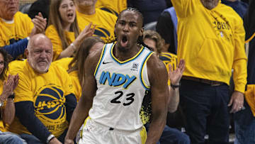 Apr 19, 2025; Indianapolis, Indiana, USA;  Indiana Pacers forward Aaron Nesmith (23) celebrates a made basket  in the first half against the Milwaukee Bucks at Gainbridge Fieldhouse. Mandatory Credit: Trevor Ruszkowski-Imagn Images
