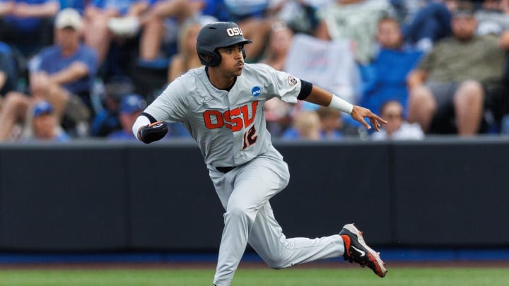 Jun 8, 2024; Lexington, KY, USA; Oregon State Beavers outfielder Micah McDowell (12) looks to steal second base during the third inning against the Kentucky Wildcats at Kentucky Proud Park. Mandatory Credit: Jordan Prather-USA TODAY Sports