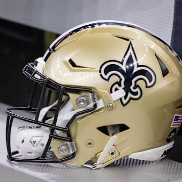 Nov 5, 2023; New Orleans, Louisiana, USA;  Detailed view of the New Orleans Saints helmet on the team bench against the Chicago Bears during the first half at the Caesars Superdome. Mandatory Credit: Stephen Lew-Imagn Images