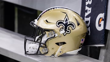 Nov 5, 2023; New Orleans, Louisiana, USA;  Detailed view of the New Orleans Saints helmet on the team bench against the Chicago Bears during the first half at the Caesars Superdome. Mandatory Credit: Stephen Lew-Imagn Images