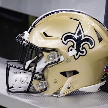 Nov 5, 2023; New Orleans, Louisiana, USA;  Detailed view of the New Orleans Saints helmet on the team bench against the Chicago Bears during the first half at the Caesars Superdome. Mandatory Credit: Stephen Lew-Imagn Images