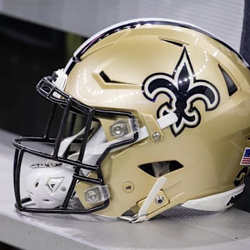 Nov 5, 2023; New Orleans, Louisiana, USA;  Detailed view of the New Orleans Saints helmet on the team bench against the Chicago Bears during the first half at the Caesars Superdome. Mandatory Credit: Stephen Lew-Imagn Images