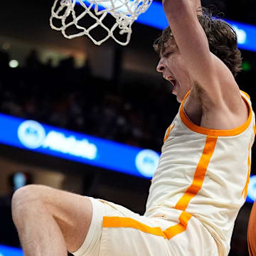 Tennessee forward Cade Phillips (12) dunks against Texas during the second half of a Southeastern Conference tournament quarterfinal game at Bridgestone Arena in Nashville, Tenn., Friday, March 14, 2025.