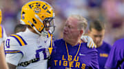 Oct 11, 2025; Baton Rouge, Louisiana, USA;  LSU Tigers head coach Brian Kelly talks to wide receiver Zavion Thomas (0) against the South Carolina Gamecocks during the first half at Tiger Stadium. Mandatory Credit: Stephen Lew-Imagn Images