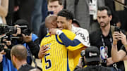 Reggie Miller hugs Indiana Pacers guard Tyrese Haliburton after winning game six of the 2025 NBA Finals between the Oklahoma City Thunder and the Indiana Pacers at Gainbridge Fieldhouse.