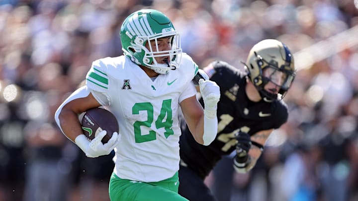Sep 20, 2025; West Point, New York, USA; North Texas Mean Green running back Caleb Hawkins (24) runs for a touchdown against the Army Black Knights during the second half at Michie Stadium. Mandatory Credit: Danny Wild-Imagn Images