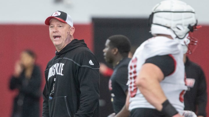 Louisville head football coach Jeff Brohm oversees practice on April 12, 2024 before the Red-White scrimmage game.