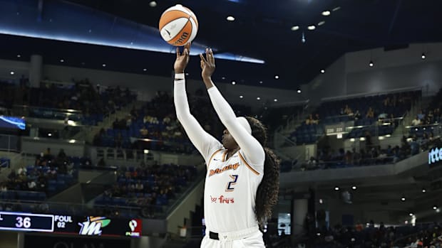 A photo of Kahleah Copper shooting the ball