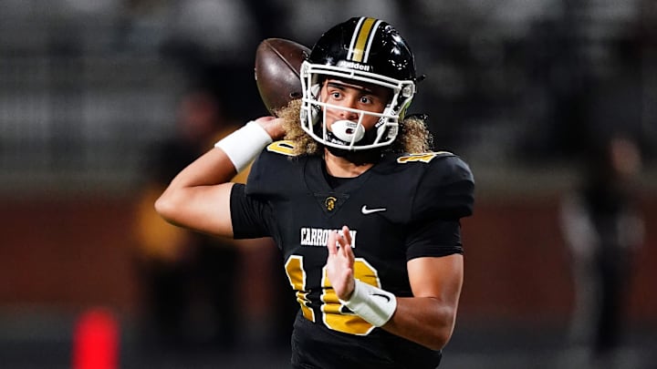 Oct 20, 2023; Carrollton, GA, USA; Carrollton Trojans quarterback Julian Lewis (10) passing against the Westlake Lions during the first half at Grisham Stadium. The 15-year-old Carrollton High student has already committed to playing for the University of Southern California Trojans and has been considered one of the top high school quarterback prospects. Mandatory Credit: John David Mercer-Imagn Images