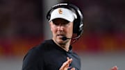 Oct 7, 2023; Los Angeles, California, USA; Southern California Trojans head coach Lincoln Riley watches game action against the Arizona Wildcats during the first half at Los Angeles Memorial Coliseum. Mandatory Credit: Gary A. Vasquez-Imagn Images