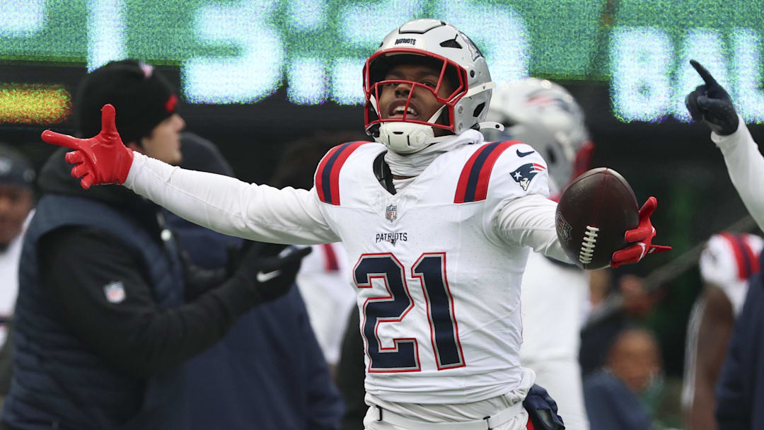 Dec 28, 2025; East Rutherford, New Jersey, USA; New England Patriots safety Jaylinn Hawkins (21) celebrates an interception against the New York Jets during the first quarter of the game at MetLife Stadium. Mandatory Credit: Vincent Carchietta-Imagn Images