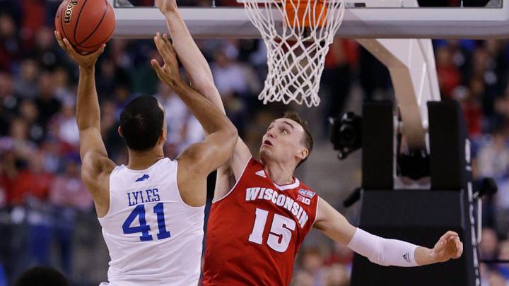 Wisconsin's Sam Dekker tries to stop Kentucky's Trey Lyles during their NCAA Final Four tournament college basketball semifinal game Saturday, April 4 2015 at Lucas Oil Stadium in Indianapolis, Ind. MARK HOFFMAN/MHOFFMAN@JOURNALSENTINEL.COM