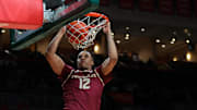 Jan 8, 2025; Coral Gables, Florida, USA; Florida State Seminoles forward Malique Ewin (12) dunks against the Miami Hurricanes during the first half at Watsco Center. Mandatory Credit: Sam Navarro-Imagn Images