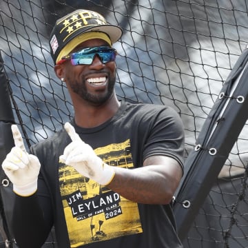 Jul 20, 2024; Pittsburgh, Pennsylvania, USA;  Pittsburgh Pirates designated hitter Andrew McCutchen (22) gestures at the batting cage before a game against the Philadelphia Phillies at PNC Park. Mandatory Credit: Charles LeClaire-USA TODAY Sports