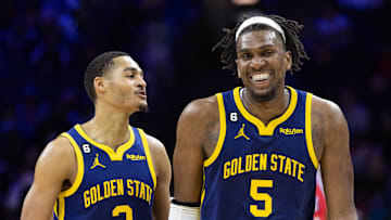 Dec 16, 2022; Philadelphia, Pennsylvania, USA; Golden State Warriors guard Jordan Poole (3) talks with center Kevon Looney (5) during a break in action against the Philadelphia 76ers during the fourth quarter at Wells Fargo Center. Mandatory Credit: Bill Streicher-Imagn Images