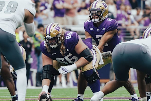 Landen Hatchett prepares to snap the ball to Demond Williams Jr. against Eastern Michigan. 