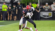 Aug 28, 2025; Orlando, Florida, USA; Jacksonville State Gamecocks wide receiver Deondre Johnson (11) is tackled by UCF Knights defensive back Jayden Bellamy (29) during the second quarter at Acrisure Bounce House. Mandatory Credit: Mike Watters-Imagn Images