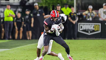 Aug 28, 2025; Orlando, Florida, USA; Jacksonville State Gamecocks wide receiver Deondre Johnson (11) is tackled by UCF Knights defensive back Jayden Bellamy (29) during the second quarter at Acrisure Bounce House. Mandatory Credit: Mike Watters-Imagn Images