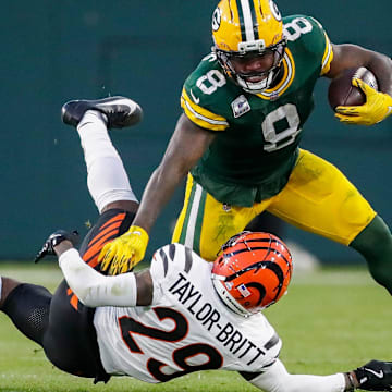 Green Bay Packers running back Josh Jacobs (8) stiff-arms Cincinnati Bengals cornerback Cam Taylor-Britt (29) on Sunday, October 12, 2025, at Lambeau Field in Green Bay, Wis. The Packers won the game, 27-18.
Tork Mason/USA TODAY NETWORK-Wisconsin