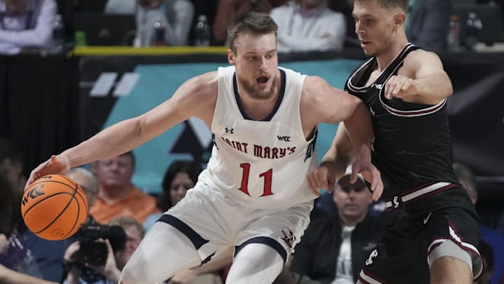 March 11, 2024; Las Vegas, NV, USA; Saint Mary's Gaels center Mitchell Saxen (11) dribbles the basketball against Santa Clara Broncos guard Jake Ensminger (44) during the second half in the semifinals of the WCC Basketball Championship at Orleans Arena. Mandatory Credit: Kyle Terada-Imagn Images March 11, 2024; Las Vegas, NV, USA; Saint Mary's Gaels center Mitchell Saxen (11) dribbles the basketball against Santa Clara Broncos guard Jake Ensminger (44) during the second half in the semifinals of the WCC Basketball Championship at Orleans Arena. Mandatory Credit: Kyle Terada-Imagn Images